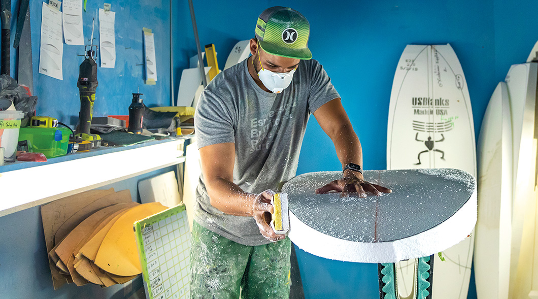 Image of a person making a surfboard